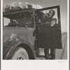 Stalled on the desert, facing a future in California. No money, ten children. From Chickasaw, Oklahoma. Southern California