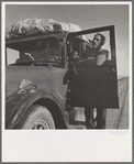 Stalled on the desert, facing a future in California. No money, ten children. From Chickasaw, Oklahoma. Southern California