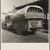 Migrant family stopped at the California-Arizona state line to have their baggage inspected for plant pests. Yuma, Arizona