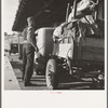 Migrant family stopped at the California-Arizona state line to have their baggage inspected for plant pests. Yuma, Arizona