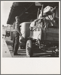 Migrant family stopped at the California-Arizona state line to have their baggage inspected for plant pests. Yuma, Arizona