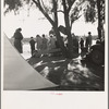 Sunday school for migrant children in a potato pickers' camp. Kern County, California