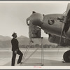 Plant quarantine inspectors examining plane at the Glendale Airport, California