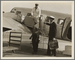 Unloading baggage for inspection after arrival of plane from Mexico. Glendale Airport, California