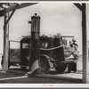 Family of nine from near Fort Smith, Arkansas, on their way to try to find work in the California harvests. Between Yuma and Phoenix, Arizona. Fourteen such cars were passed one afternoon on this highway