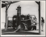 Family of nine from near Fort Smith, Arkansas, on their way to try to find work in the California harvests. Between Yuma and Phoenix, Arizona. Fourteen such cars were passed one afternoon on this highway