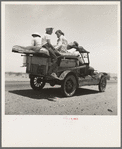 Migratory family traveling across the desert in search of work in the cotton at Roswell, New Mexico. U.S. Route 70, Arizona