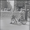 Boys on tricycle. New York, NY