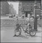 Boys on tricycle. New York, NY