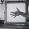 Hand framed by lightbox