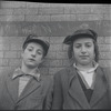 Boys in front of brick wall. New York, NY
