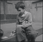 Boy playing cards. New York, NY