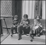 Children sitting on front steps. New York, NY