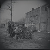 Cat sitting on a dilapidated car