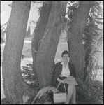 Sima Huberland seated under a tree