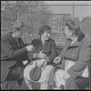 Three women conversing on bench. New York, NY