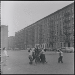 Boys playing in an empty lot. New York, NY