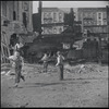 Children playing in a dilapidated lot. New York, NY