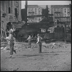 Children playing in a dilapidated lot. New York, NY