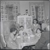 Family at mealtime. New York, NY