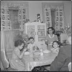 Family at mealtime. New York, NY