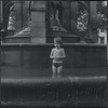 Child playing in fountain