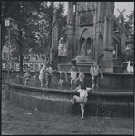 Children playing in fountain