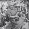 Seated women with head coverings