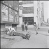 Man asleep on sidewalk. New York, NY