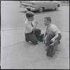 Two boys on a street corner. New York, NY