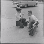 Two boys on a street corner. New York, NY