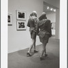 Two men in drag walking in MoMA galleries