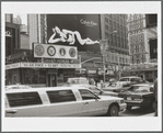 U.S. Armed Forces Recruiting Center, model for Calvin Klein Underwear billboard advertisment and a limo car in the foreground in Times Square