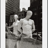Two male mannequins in store window