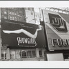 Showgirls movie poster on billboard advertisement, next to Fuji Film billboard advertisment in Times Square area