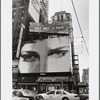 "Get Met. It Pays" Metlife billboard advertisement next to hotel sign in Times Square area
