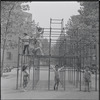 Children playing on monkey bars. New York, NY