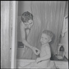 Father and son at bathtime. New York, NY