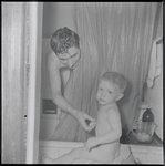 Father and son at bathtime. New York, NY
