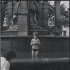 Child playing in fountain