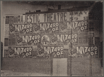 Posters advertising the stage production The Wizard of Oz plastered on building during run at the Majestic Theatre