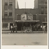 Idle men attend the morning movies. There are three such movies in one block. Oklahoma City, Oklahoma