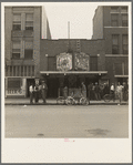 Idle men attend the morning movies. There are three such movies in one block. Oklahoma City, Oklahoma