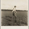 Tenant farmer spreading grasshopper bait in his alfalfa field, five miles from Oklahoma City, Oklahoma