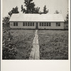 Newly erected community house at the Delta cooperative farm. Hillhouse, Mississippi. This building houses the library, school, clinic and meeting rooms