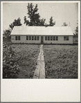 Newly erected community house at the Delta cooperative farm. Hillhouse, Mississippi. This building houses the library, school, clinic and meeting rooms
