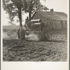 Tractor and driver on the Aldridge Plantation. [Near Leland,] Mississippi