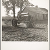 Tractor and driver on the Aldridge Plantation. [Near Leland,] Mississippi