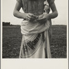 Farm boy with sack full of boll weevils which he has picked off of cotton plants. Macon County, Georgia