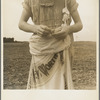 Farm boy with sack full of boll weevils which he has picked off of cotton plants. Macon County, Georgia